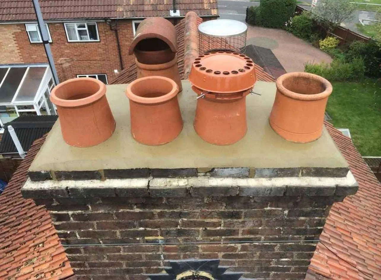 Rebuilt chimney stack with new clay pots