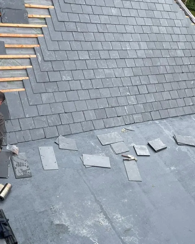 Slate roof being re-slated