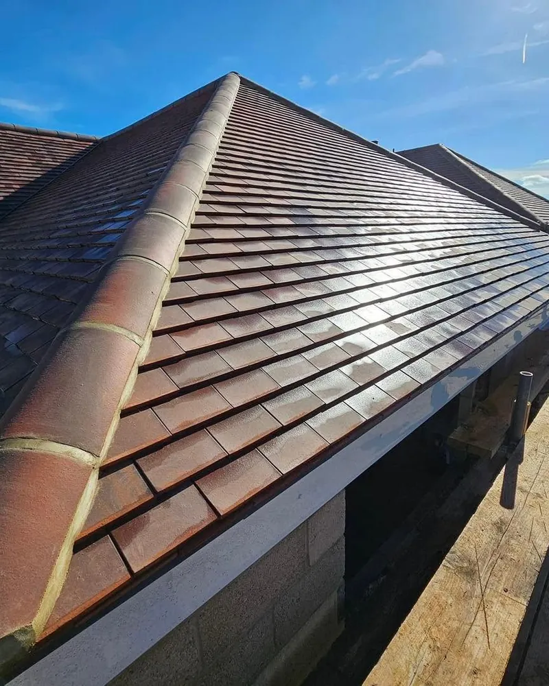 Close view of new dark interlocking roof tiles
