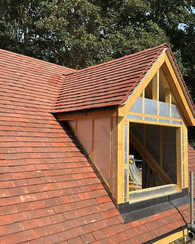 Red tiled dormer with timber cheeks