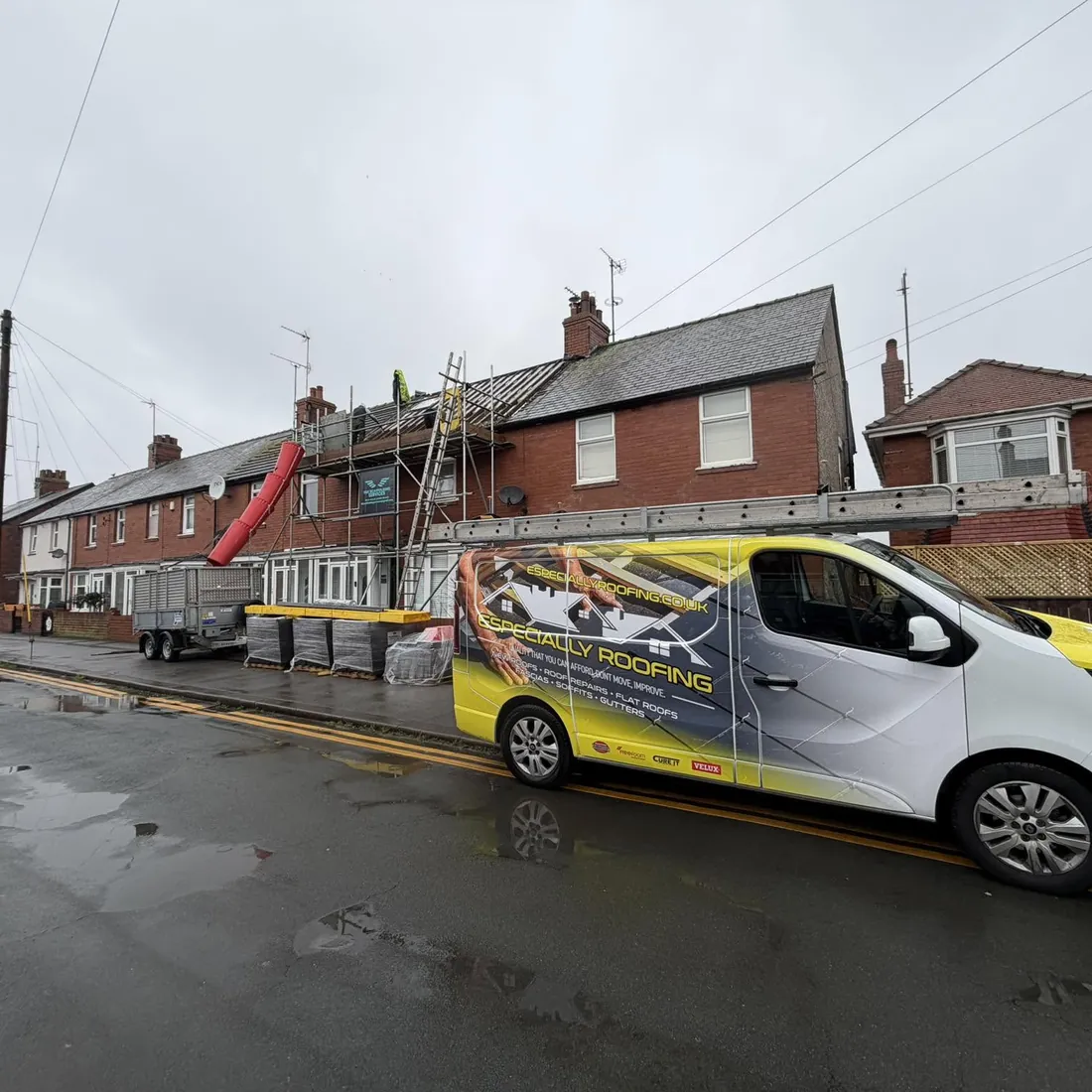 An Especially Roofing van outside a house being re-roofed